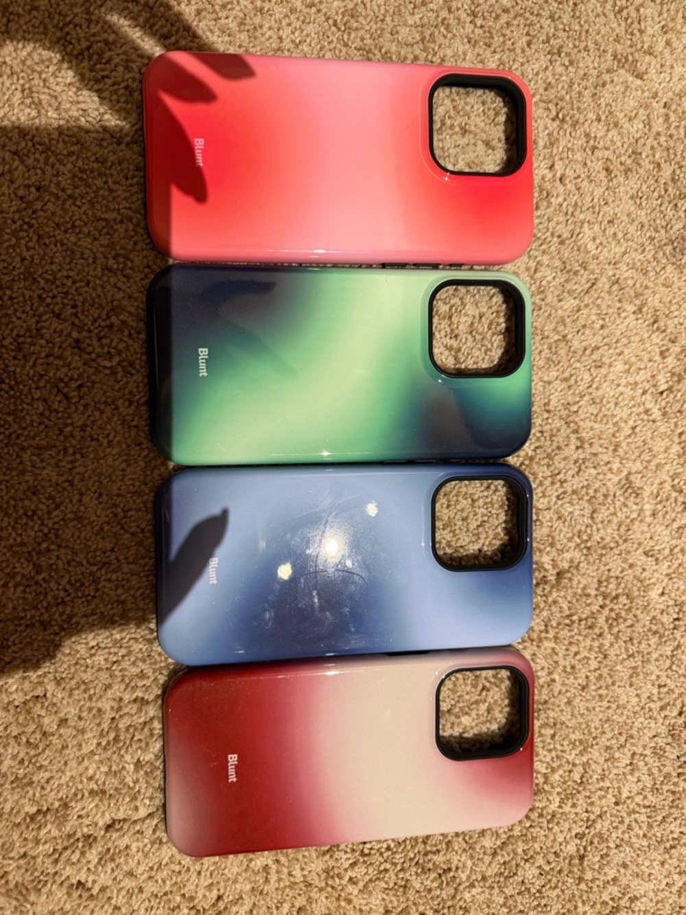 Blunt phone cases in different aura colors for iPhone 16 pro max